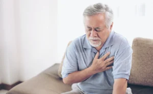 Man experiencing heartburn chest pain - Gastroenterology and Nutrition Forest Hills
